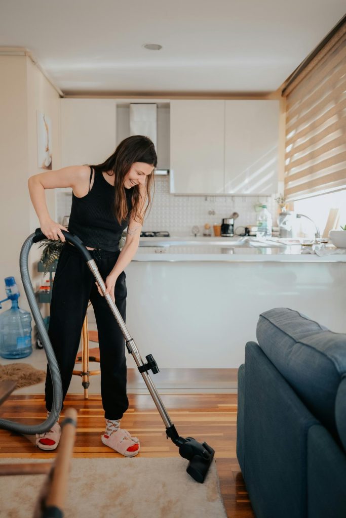 woman vacuuming living room