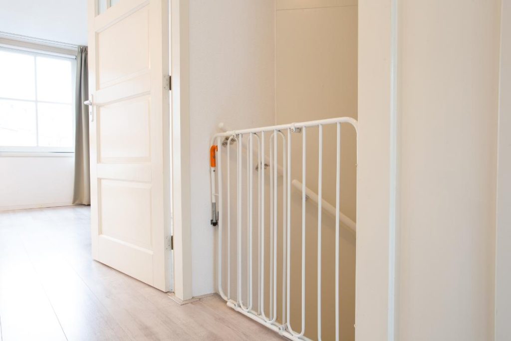 baby gate blocking stairs in a new home