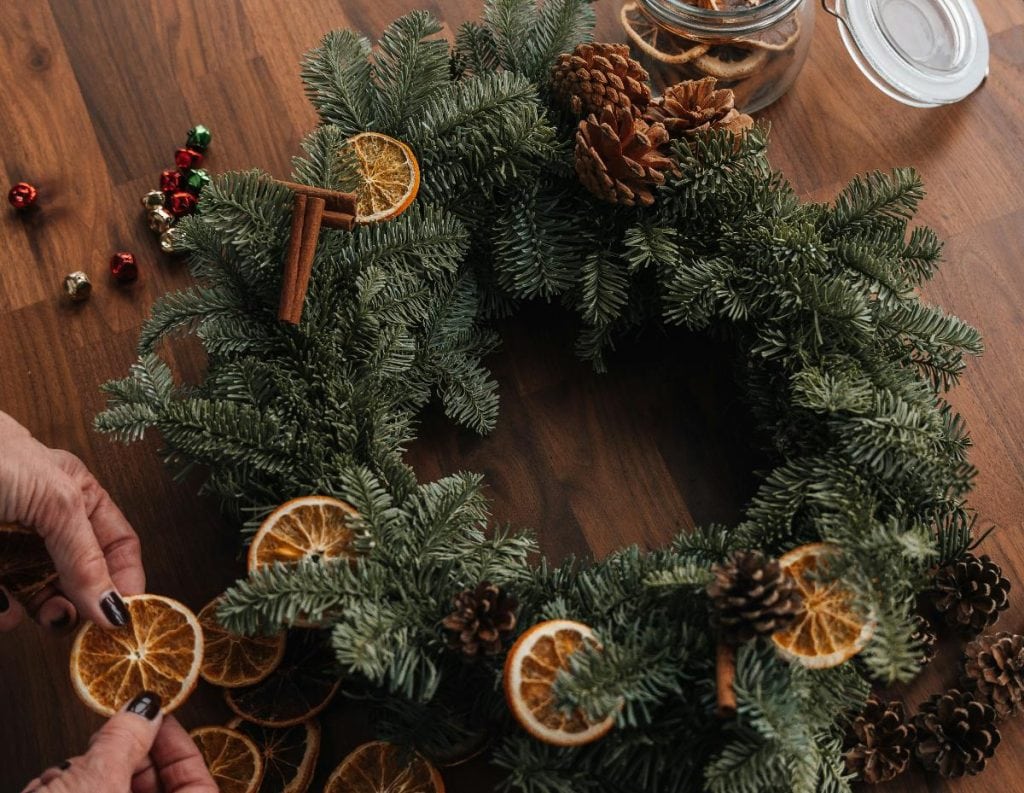 christmas wreath with pinecones and orange slices