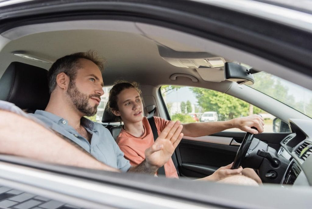 dad teaching teen to drive