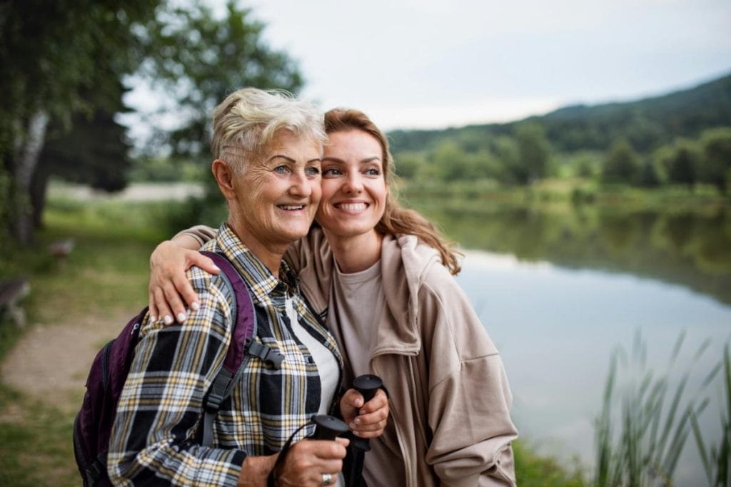 elderly woman and adult daughter on a nature hike