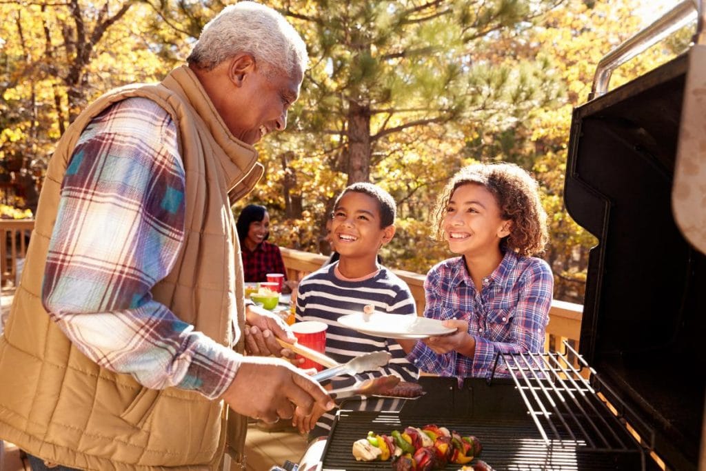 grandpa grilling with grandkids