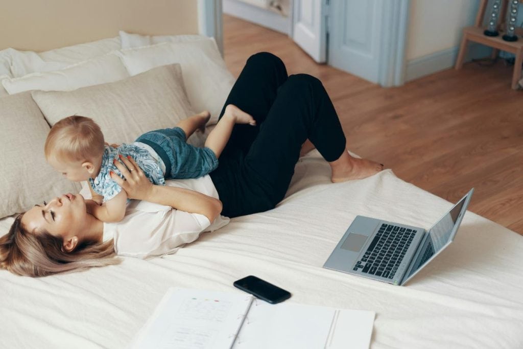 mom taking a break from work to hold baby