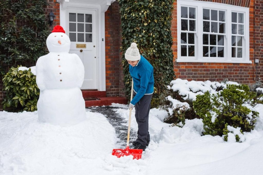 person shoveling walkway