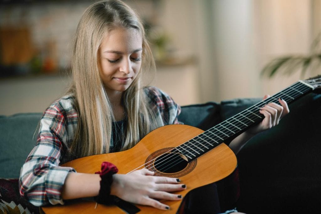 teen girl with guitar