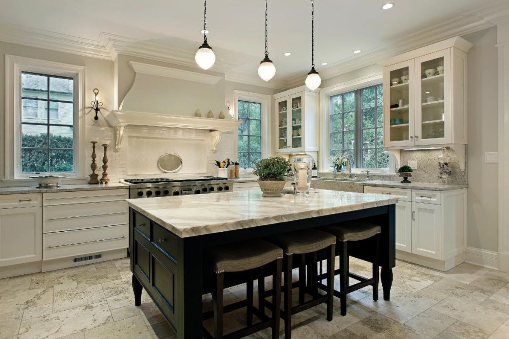 a kitchen with a large island and plenty of cabinet space