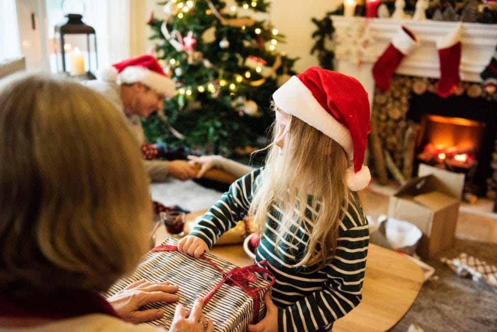 little girl giving a gift