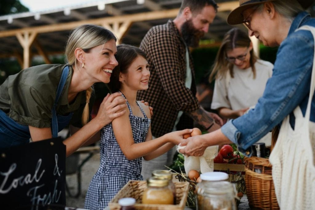 little girl shopping at farmers market