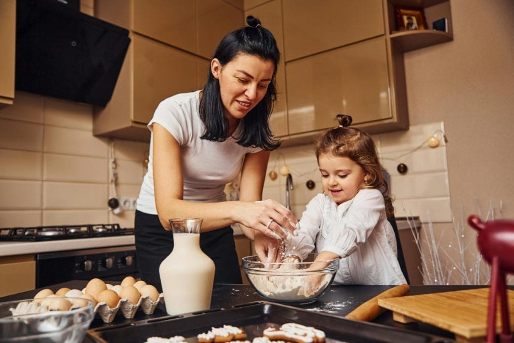 mother and daughter cooking