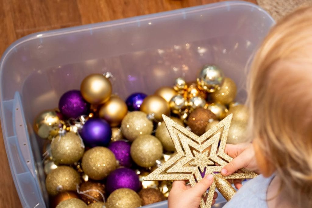 christmas ornaments in a plastic storage box