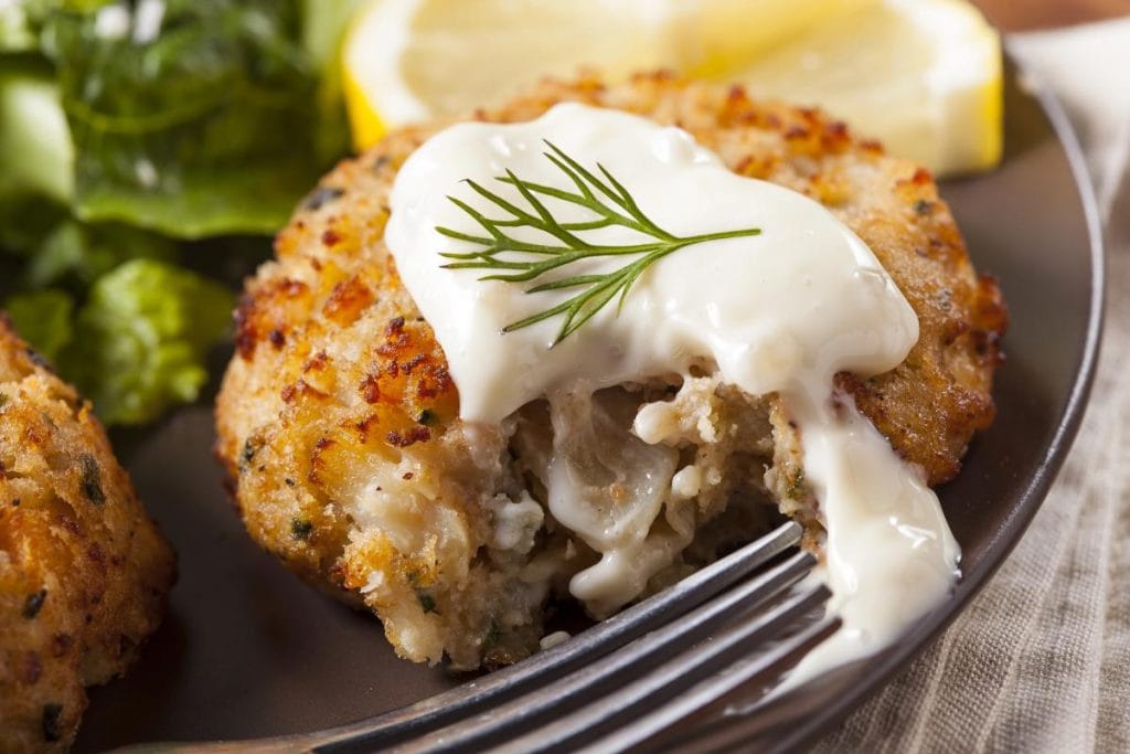 crab cake with sauce up close