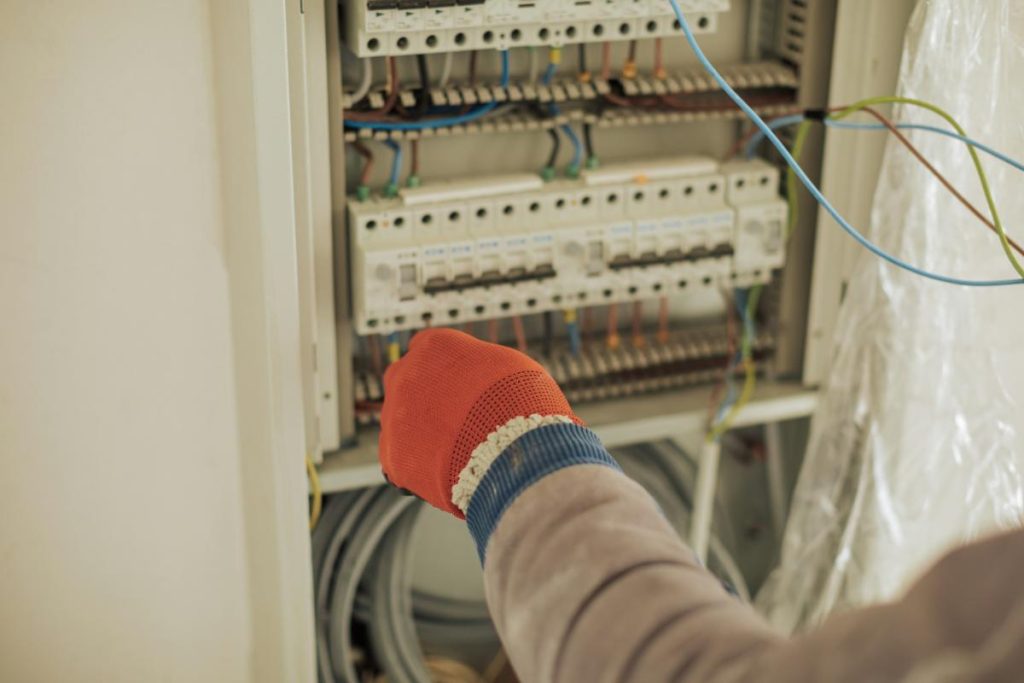 electrician working on an electrical panel