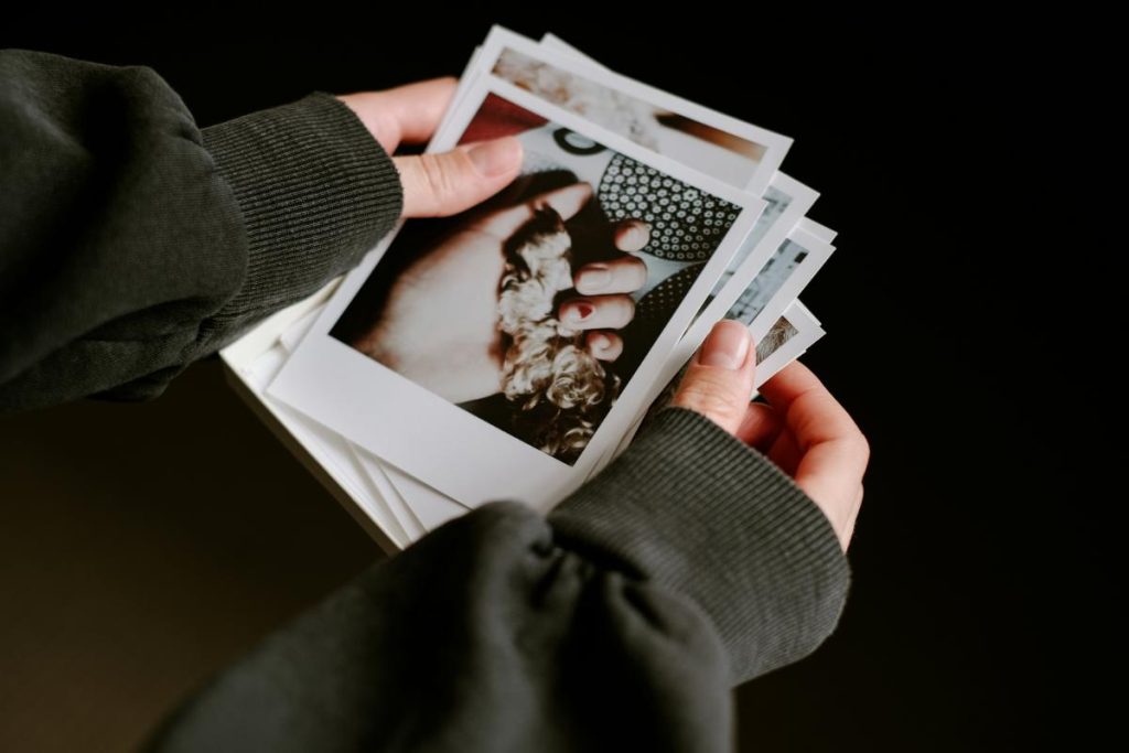 looking through a stack of photos