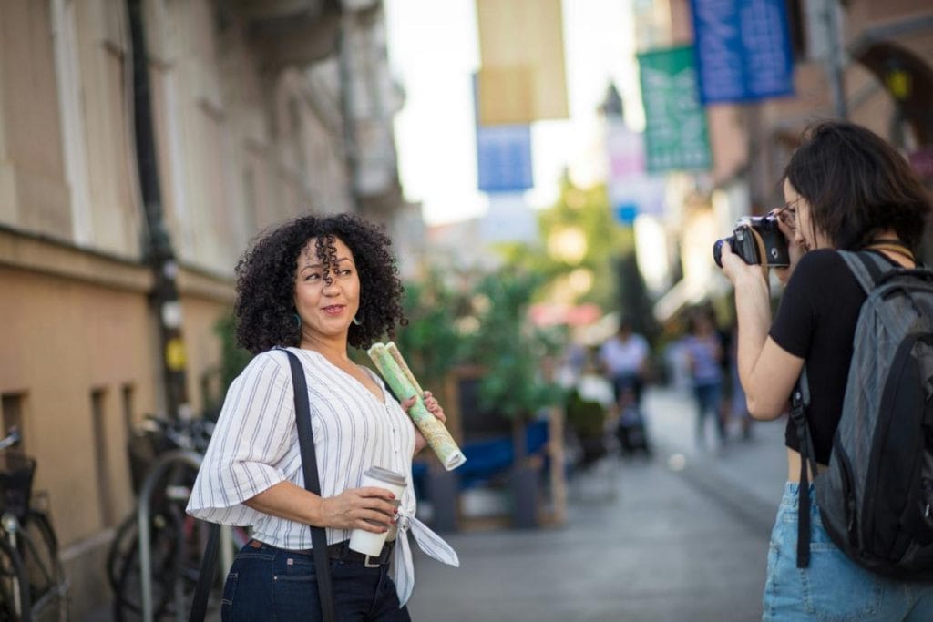 woman posing on the street for the photographer