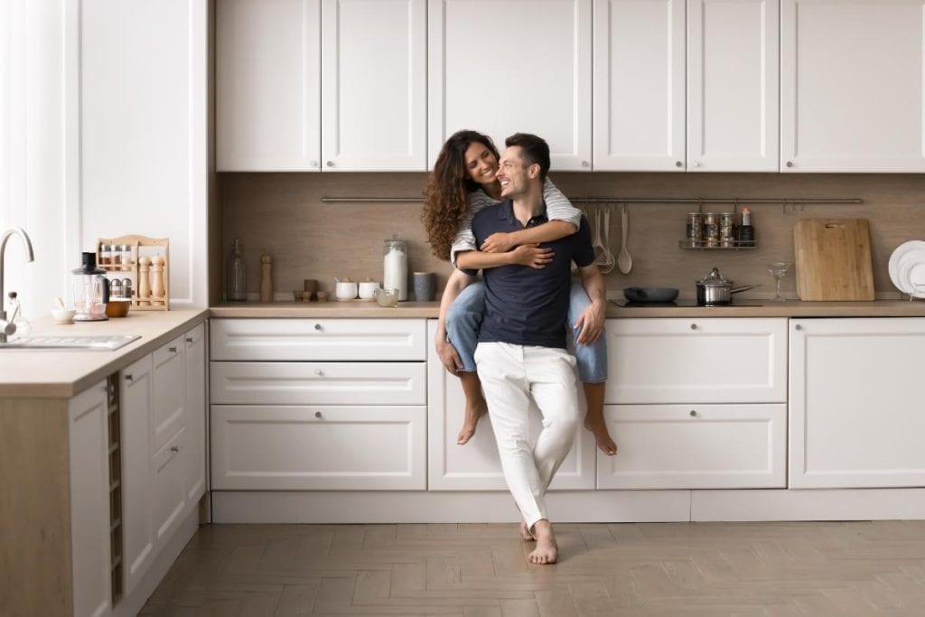 couple sitting in a remodeled kitchen