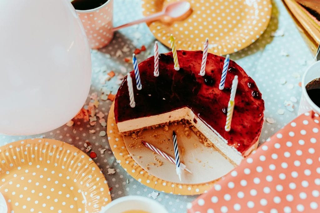 cut birthday cheesecake