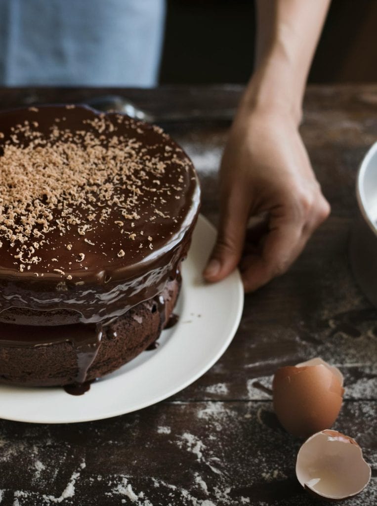 a chocolate cake covered with chocolate ganache