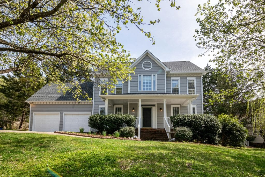 facade of a gray house with 2 car garage