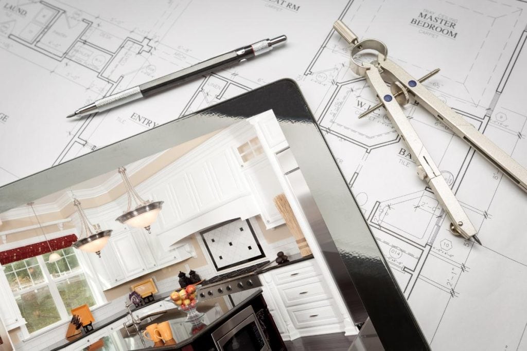 house blueprints with kitchen interior design on tablet