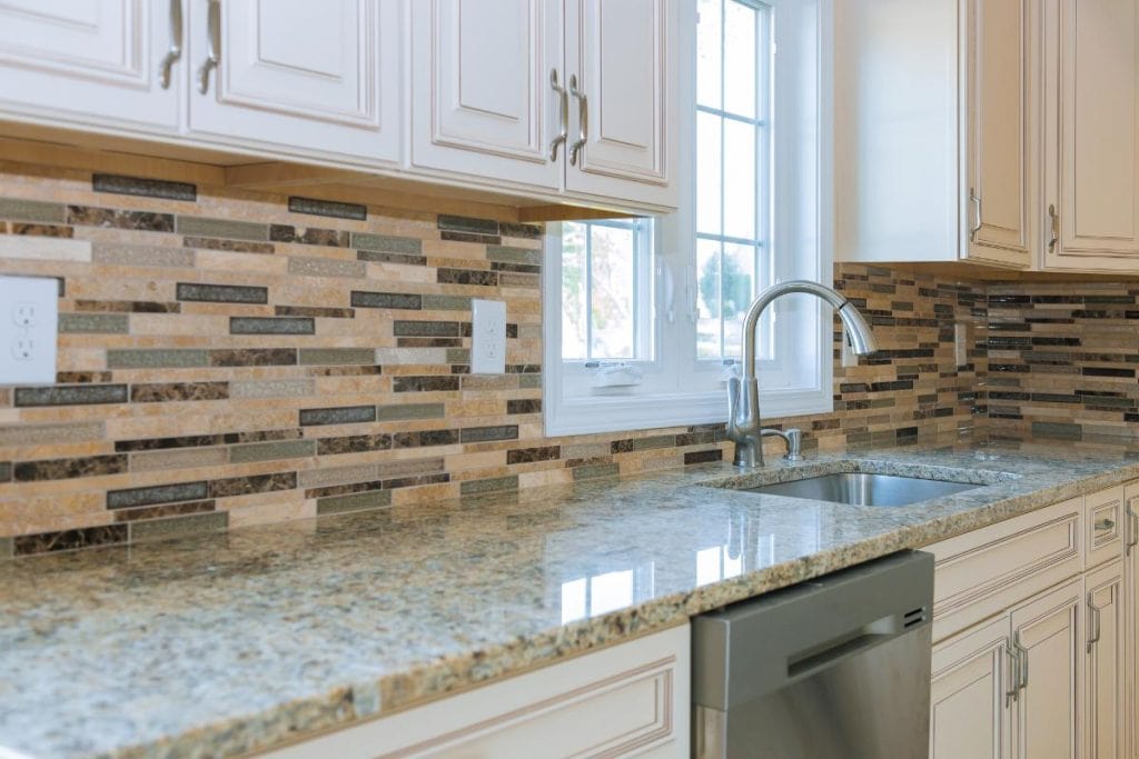 cabinets with stone backsplash