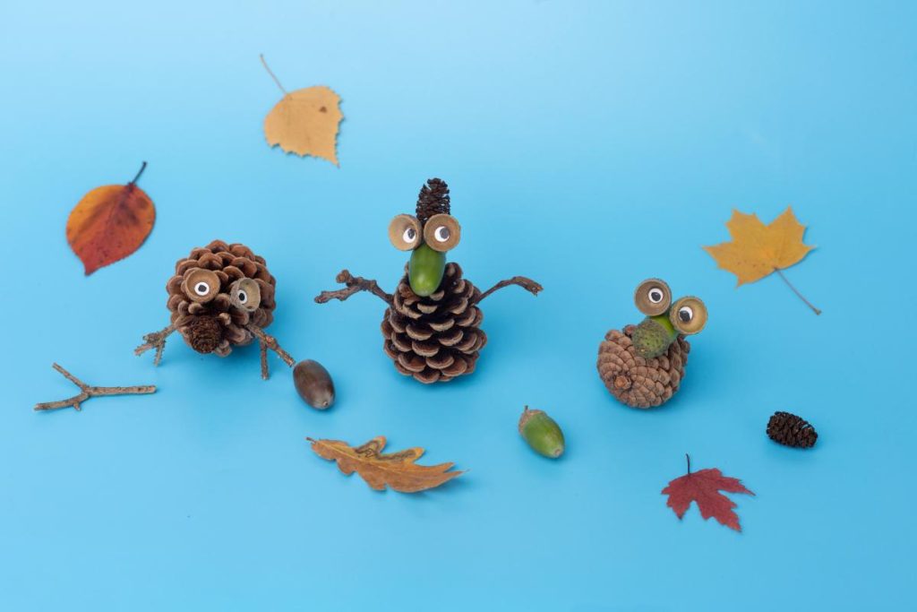 pine cone creatures on blue background