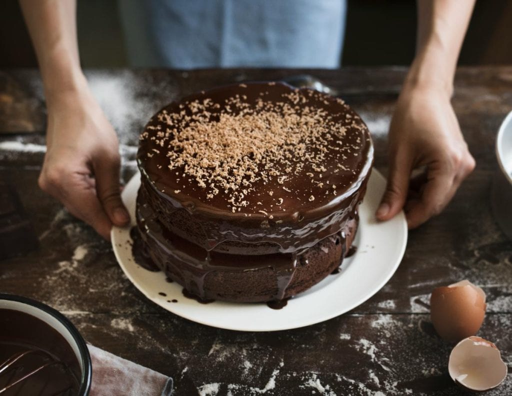 two layer chocolate cake on white plate