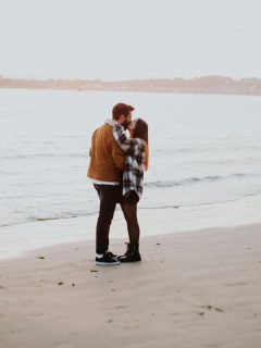 couple kissing on the beach