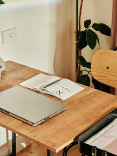 laptop and planner on desk