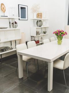 white dining chairs at white table