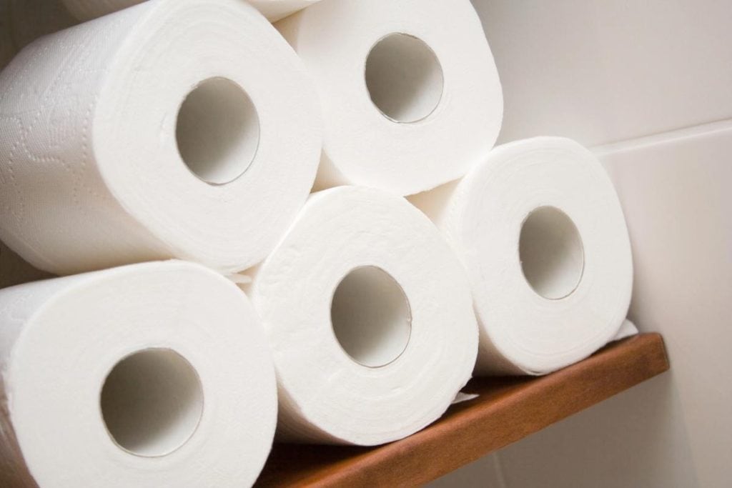 5 rolls of toilet paper on a shelf