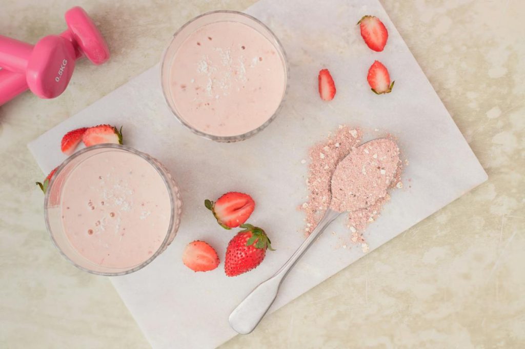 overview shot of two strawberry smoothies