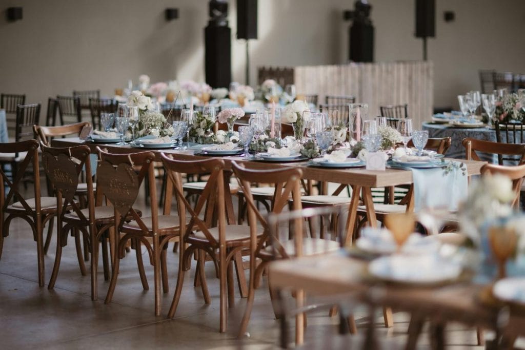 looking at table and chairs for indoor wedding - tablescape for wedding