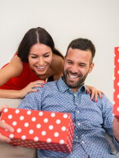 wife surprising husband with a gift