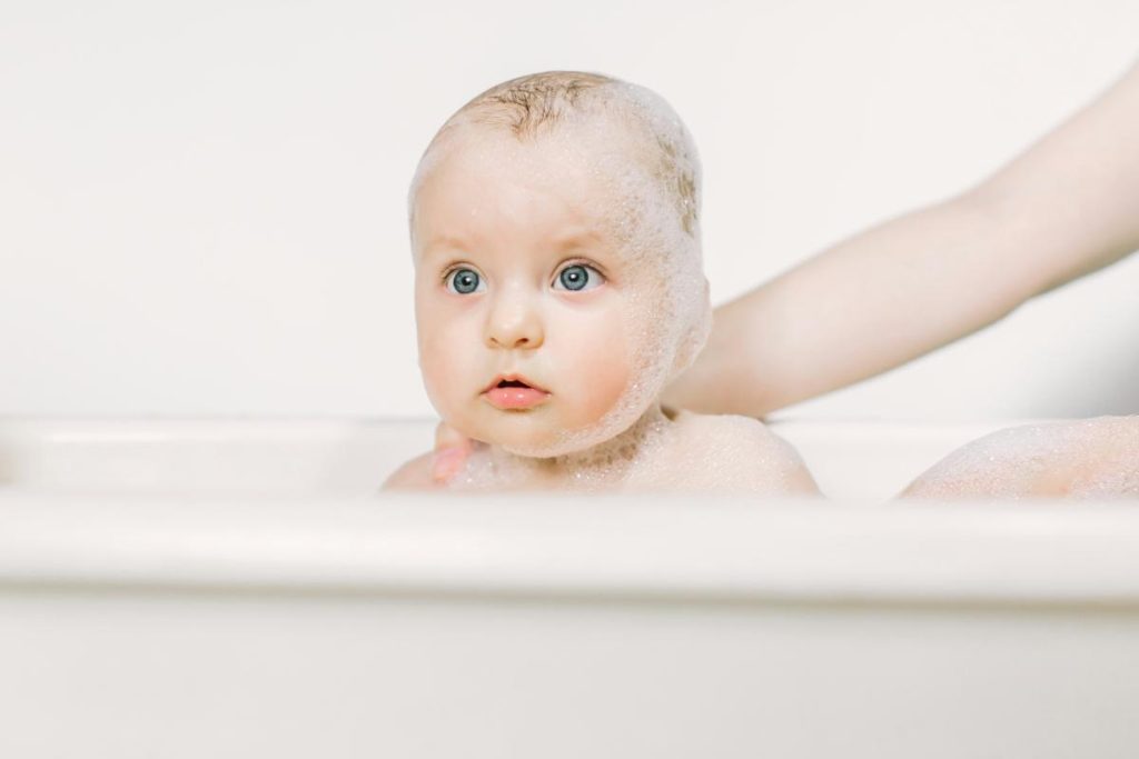 soapy baby in bathtub