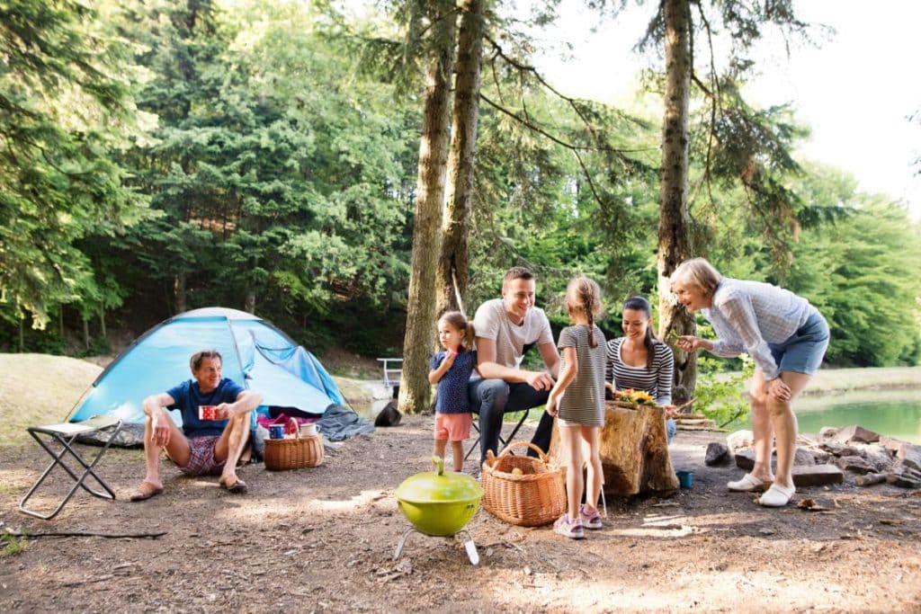 family at campsite - grandparents, grandkids, and parents