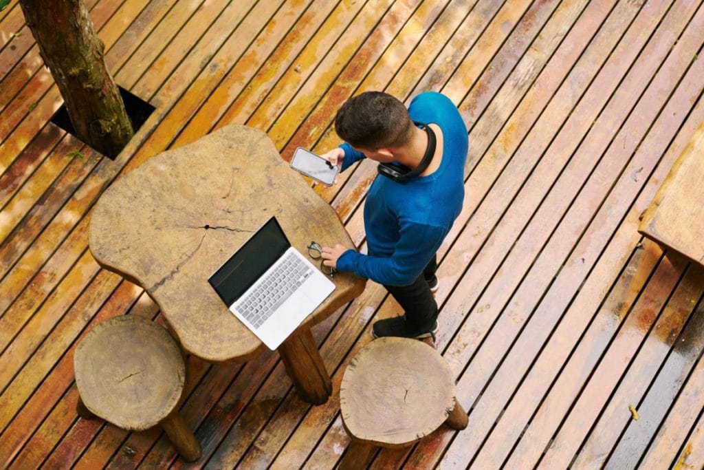 man on deck with laptop