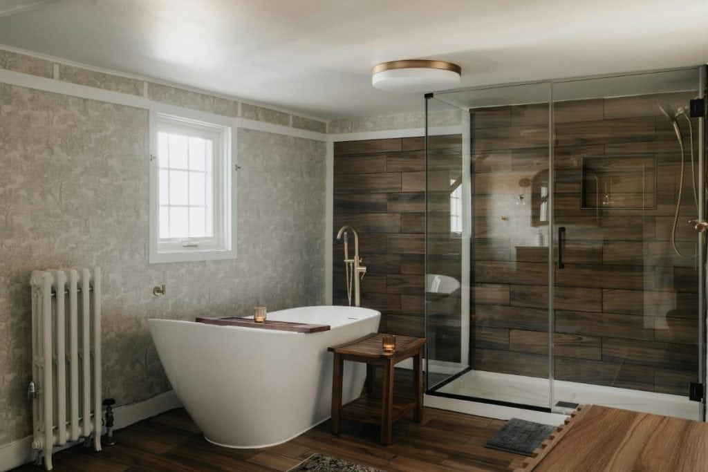 pretty bathroom with separate tub and shower