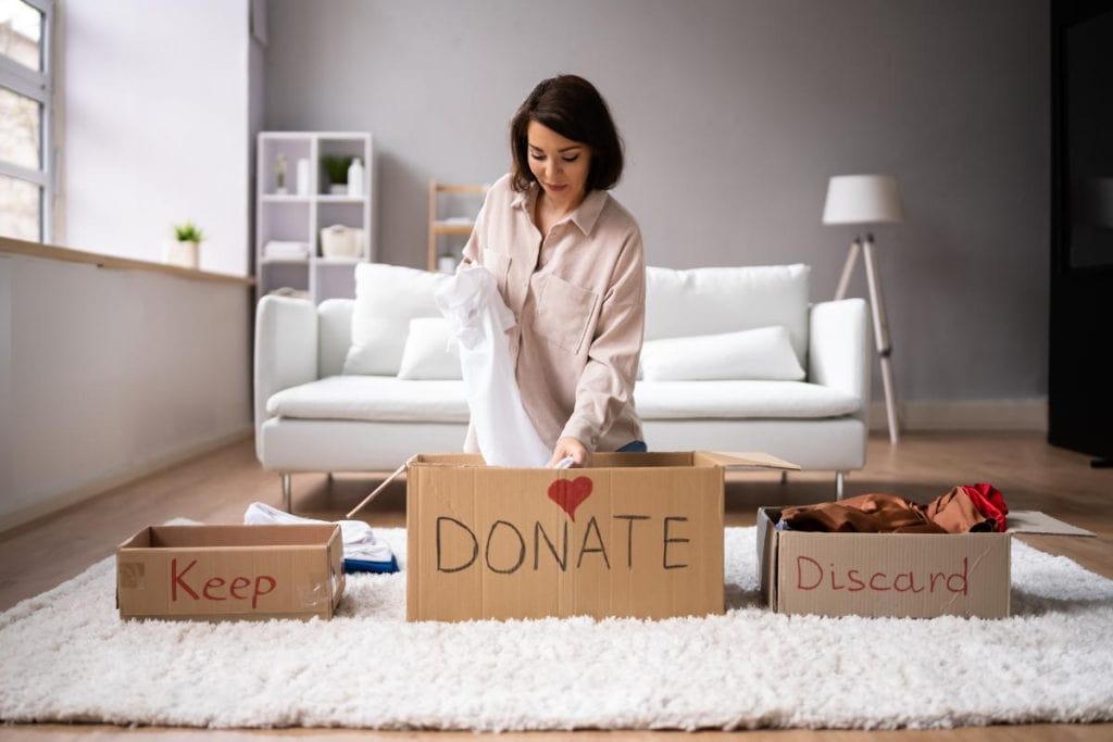 woman decluttering her clothes