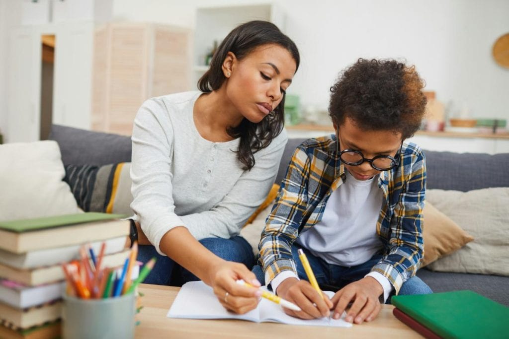 tutor helping boy with homework