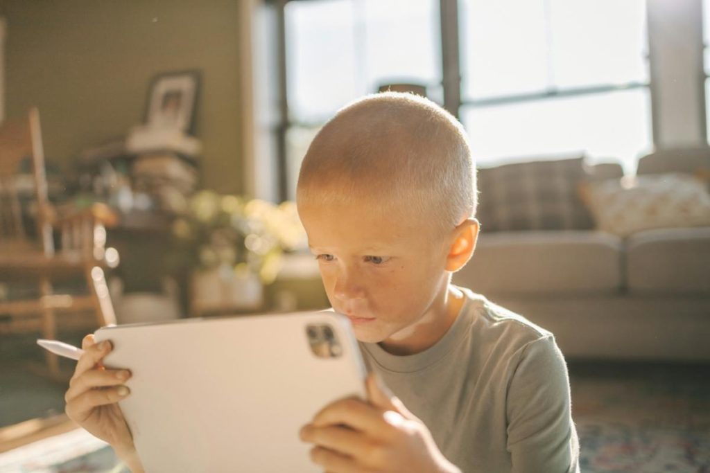 little boy using a tablet