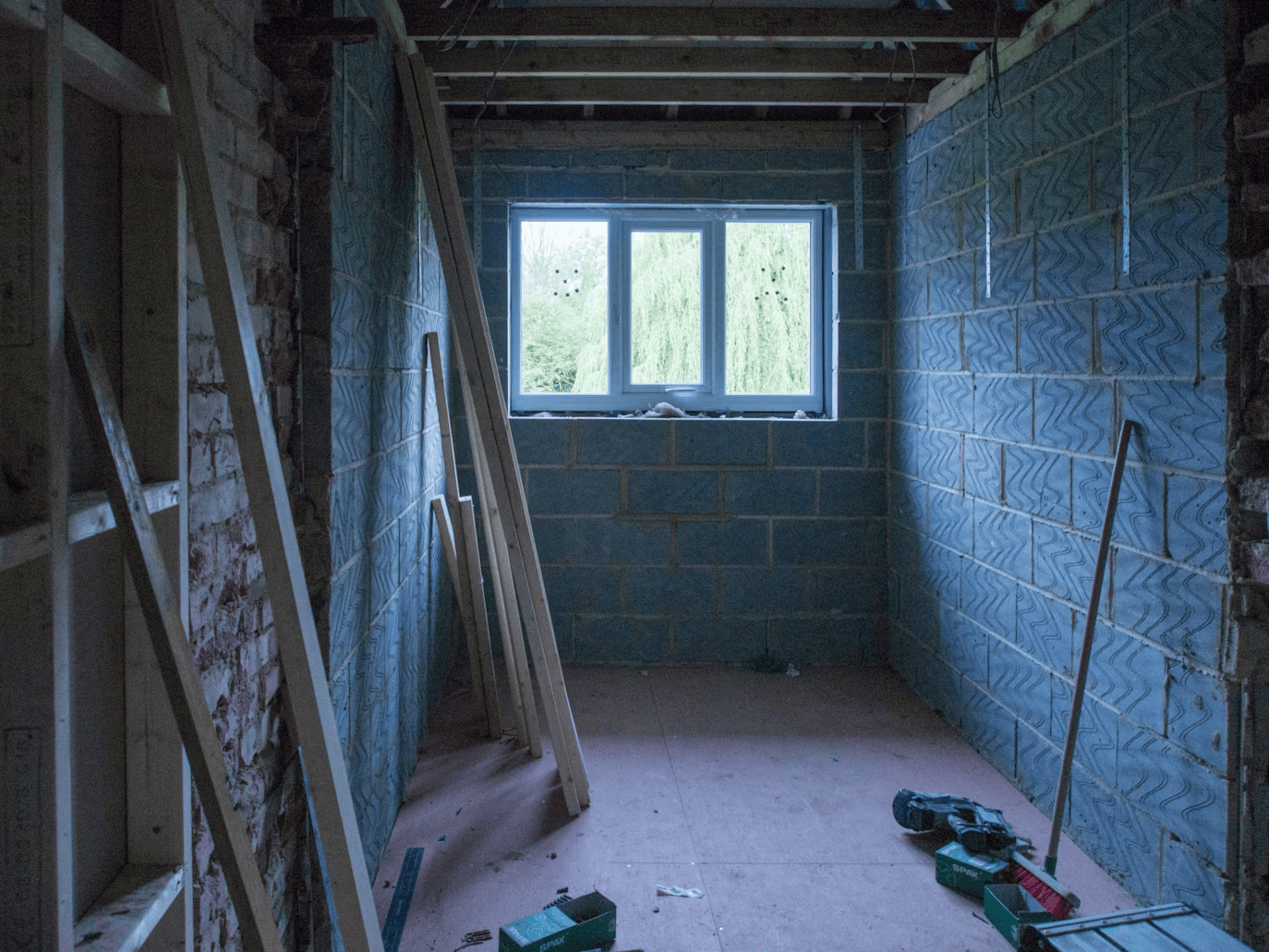 renovations on brick and cinderblock room