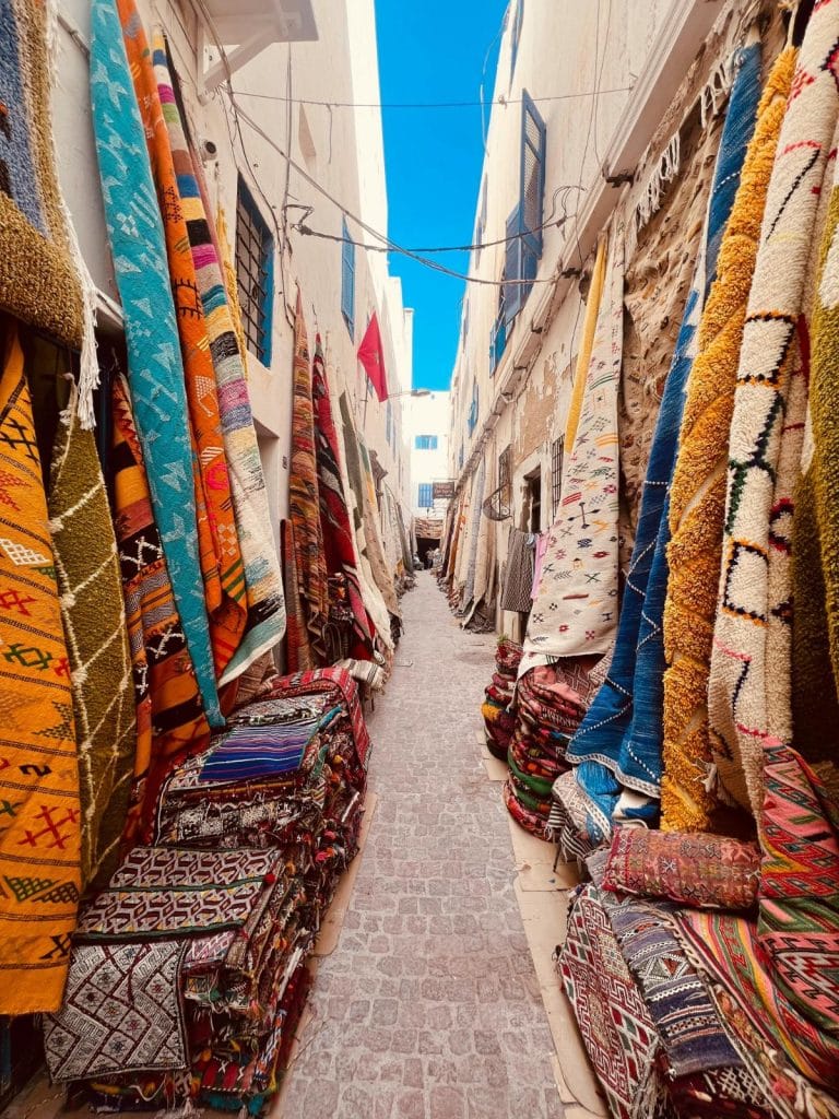 alleyway with rugs for sale