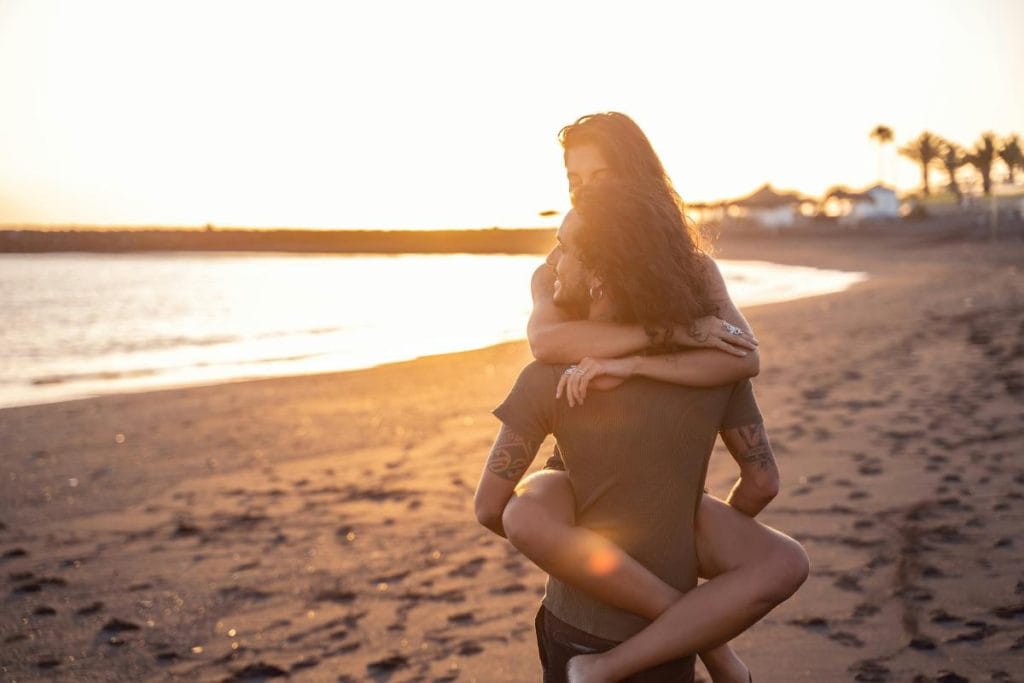 couple embracing on the beach