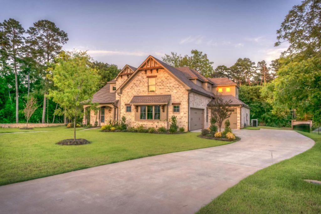 large brick home with long driveway