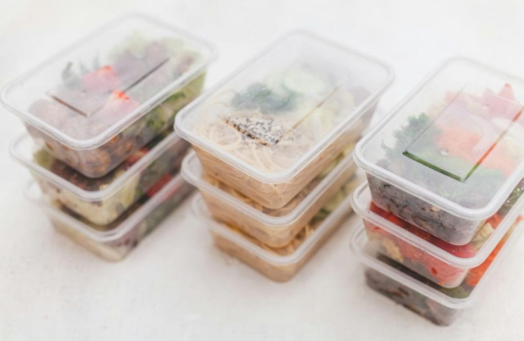 meal prepped lunches in containers ready to be put in an insulated lunch bag