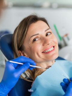 smiling woman at dentist