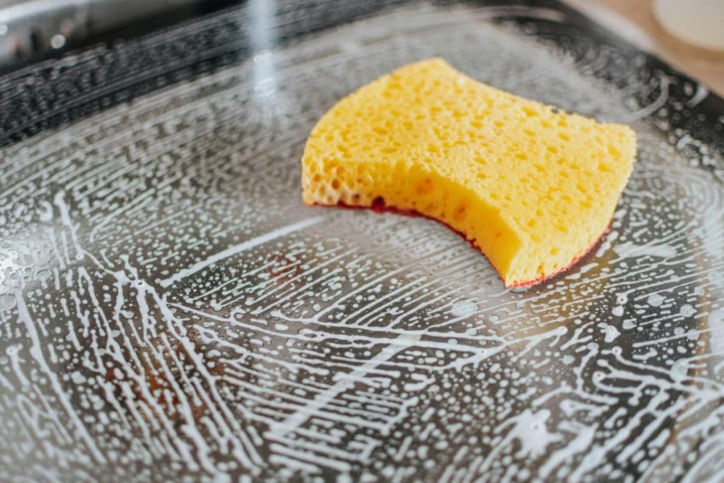 sponge on soapy glass