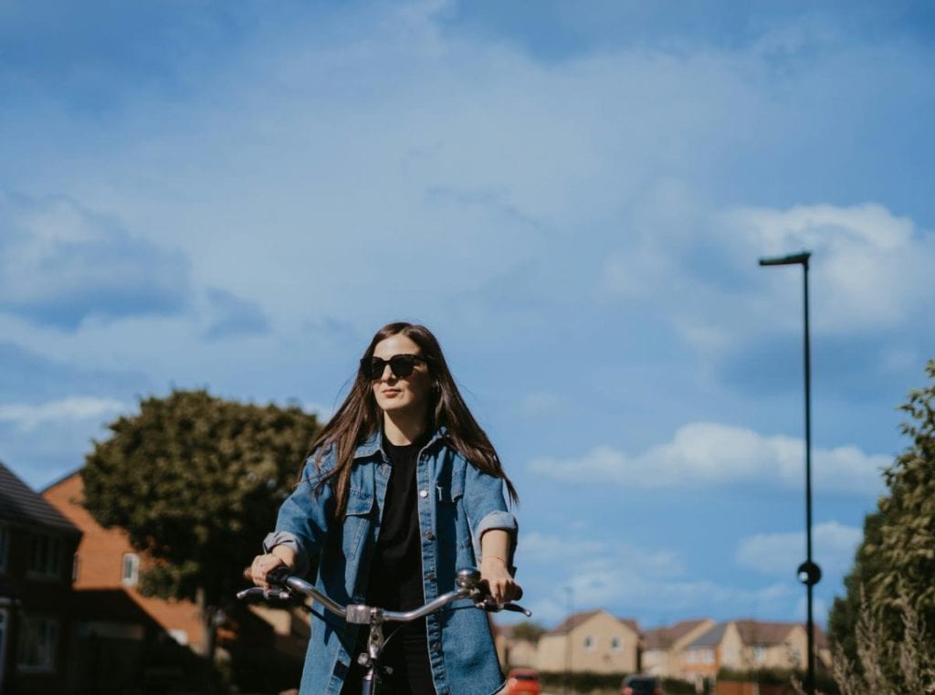 woman riding a bicycle on a nice day