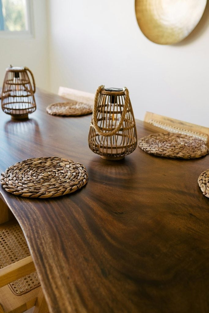 wooden table with wicker placemats