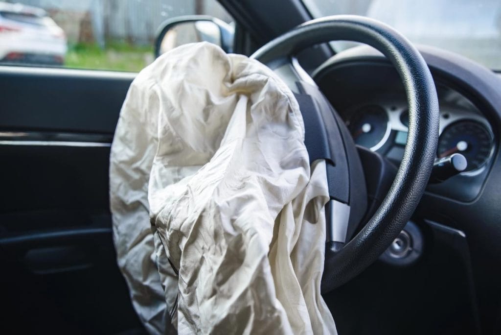 airbag open on car steering wheel